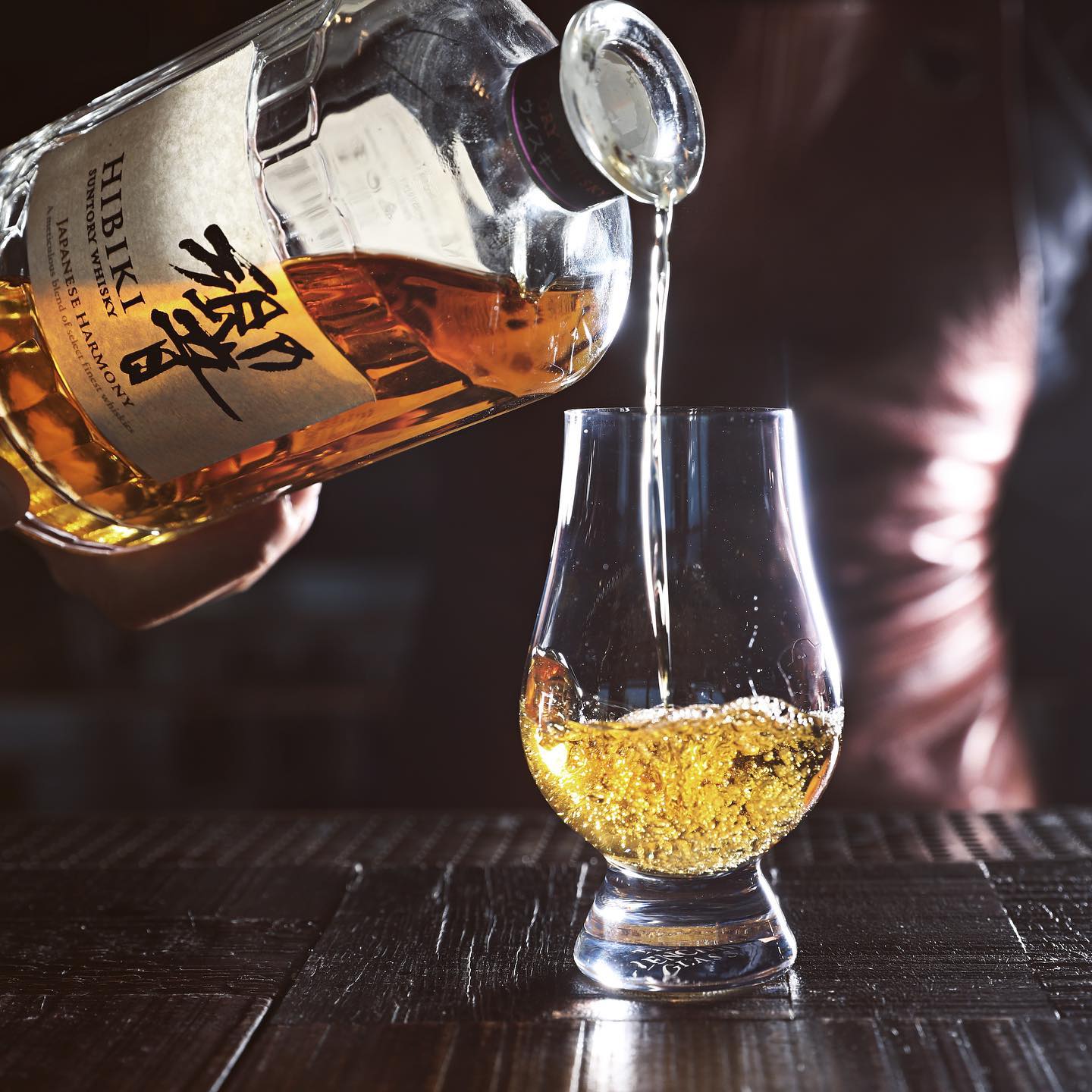 whiskey being served at CLAP Dubai, a japanese fine dining restaurant