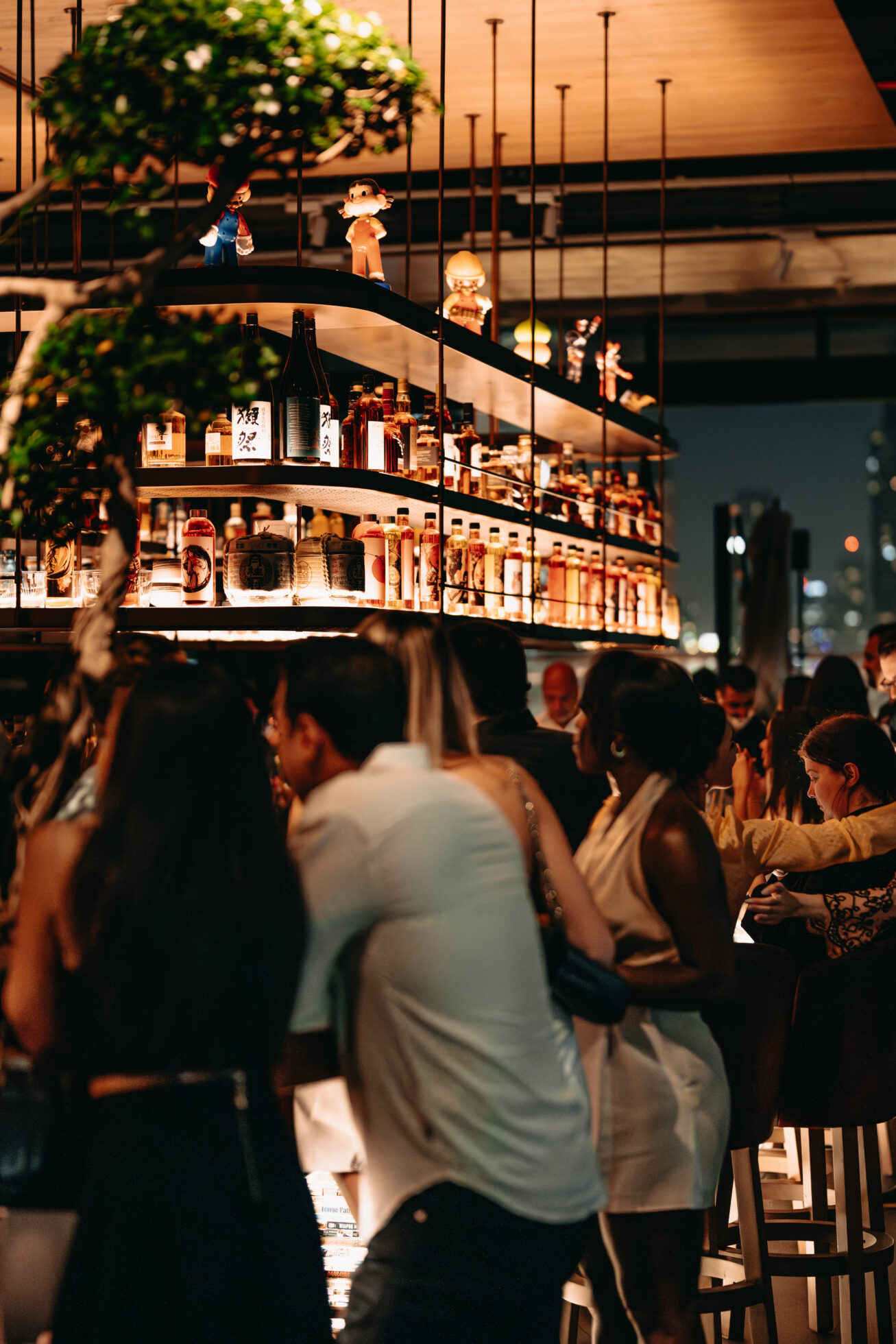 People standing next to bar counter