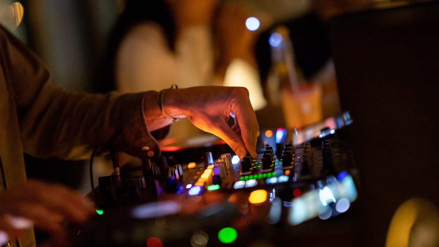 DJ remixes the music during a CLAP Dubai event